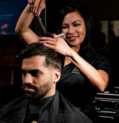 man receives haircut